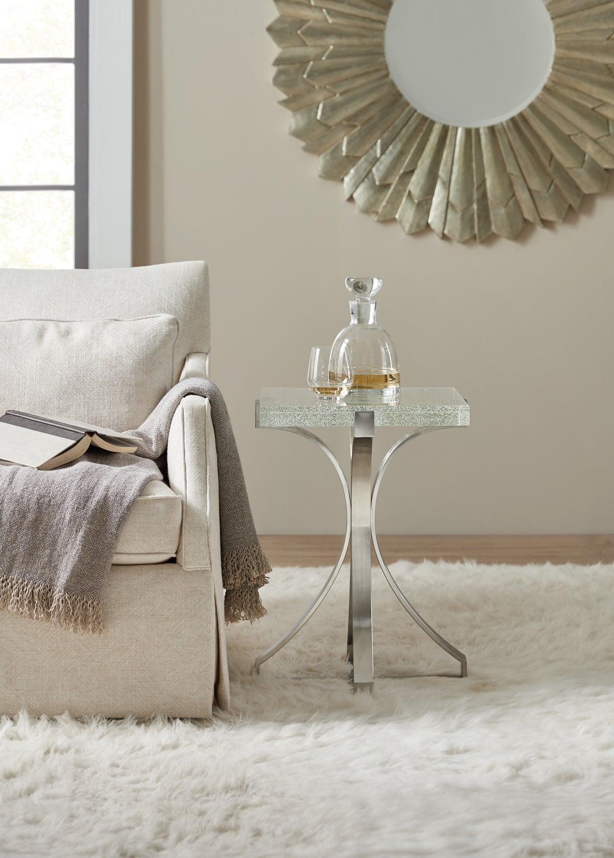 a glass table next to a couch