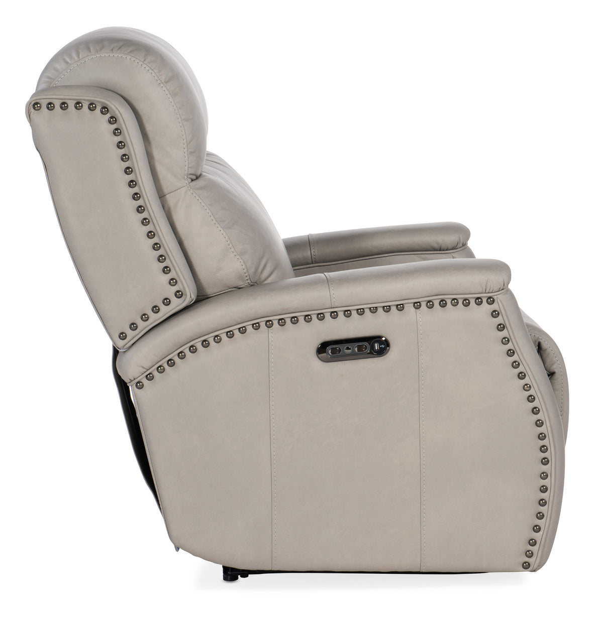 a white recliner with studs