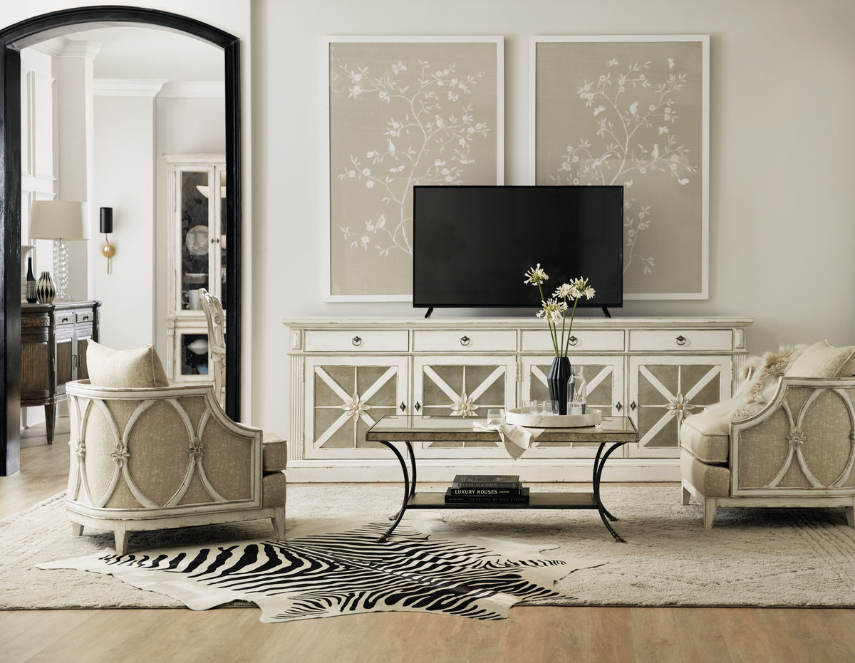 a living room with a television and a mirror