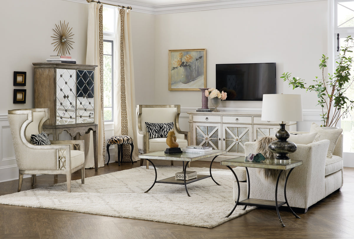 a living room with a tv and a table