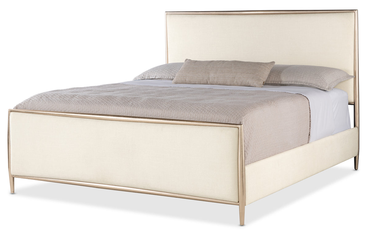 a bed with a white headboard
