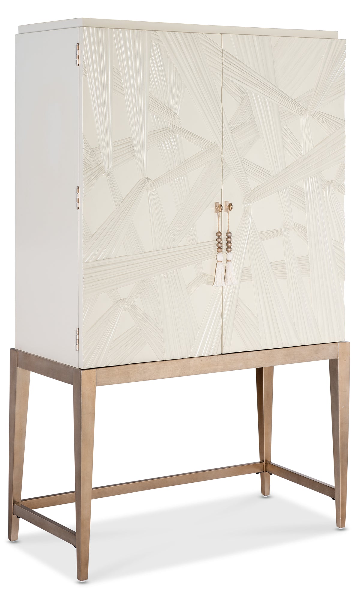 a white cabinet with gold handles