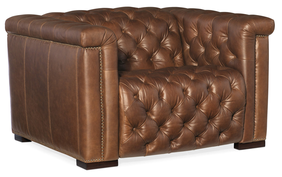 a brown leather chair with buttons