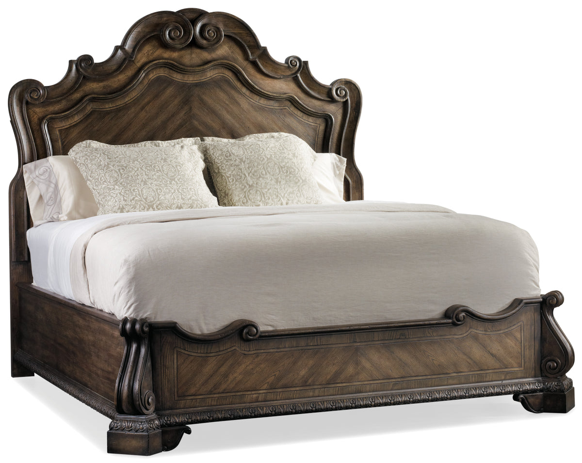 a bed with white sheets and pillows