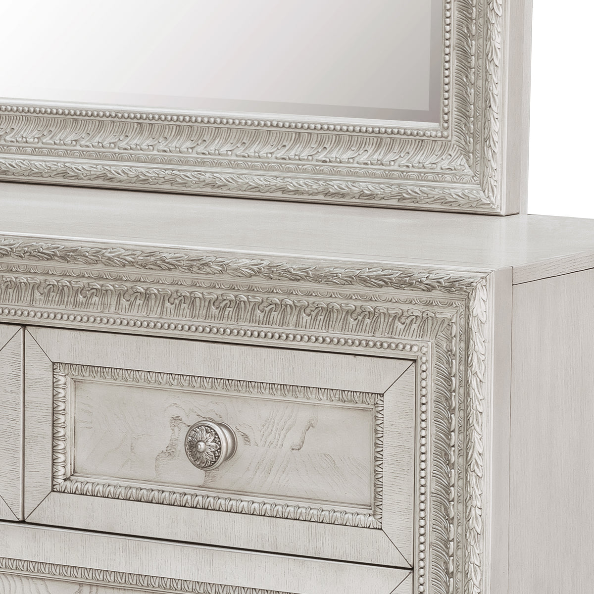 a white dresser with a mirror