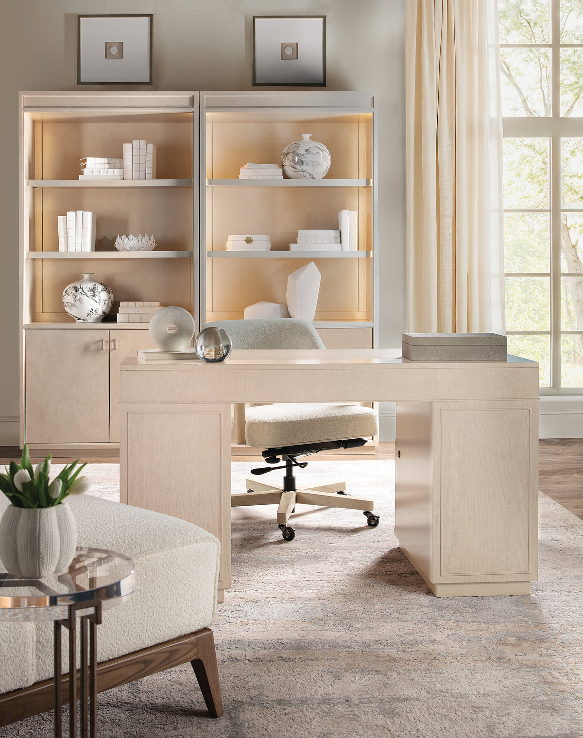 a white desk in a room with a white chair and a white chair