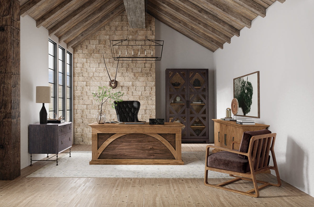 a room with a desk chair and a chair