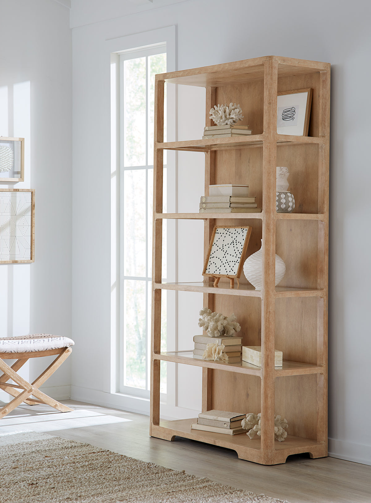 a wooden shelf with books and objects on it