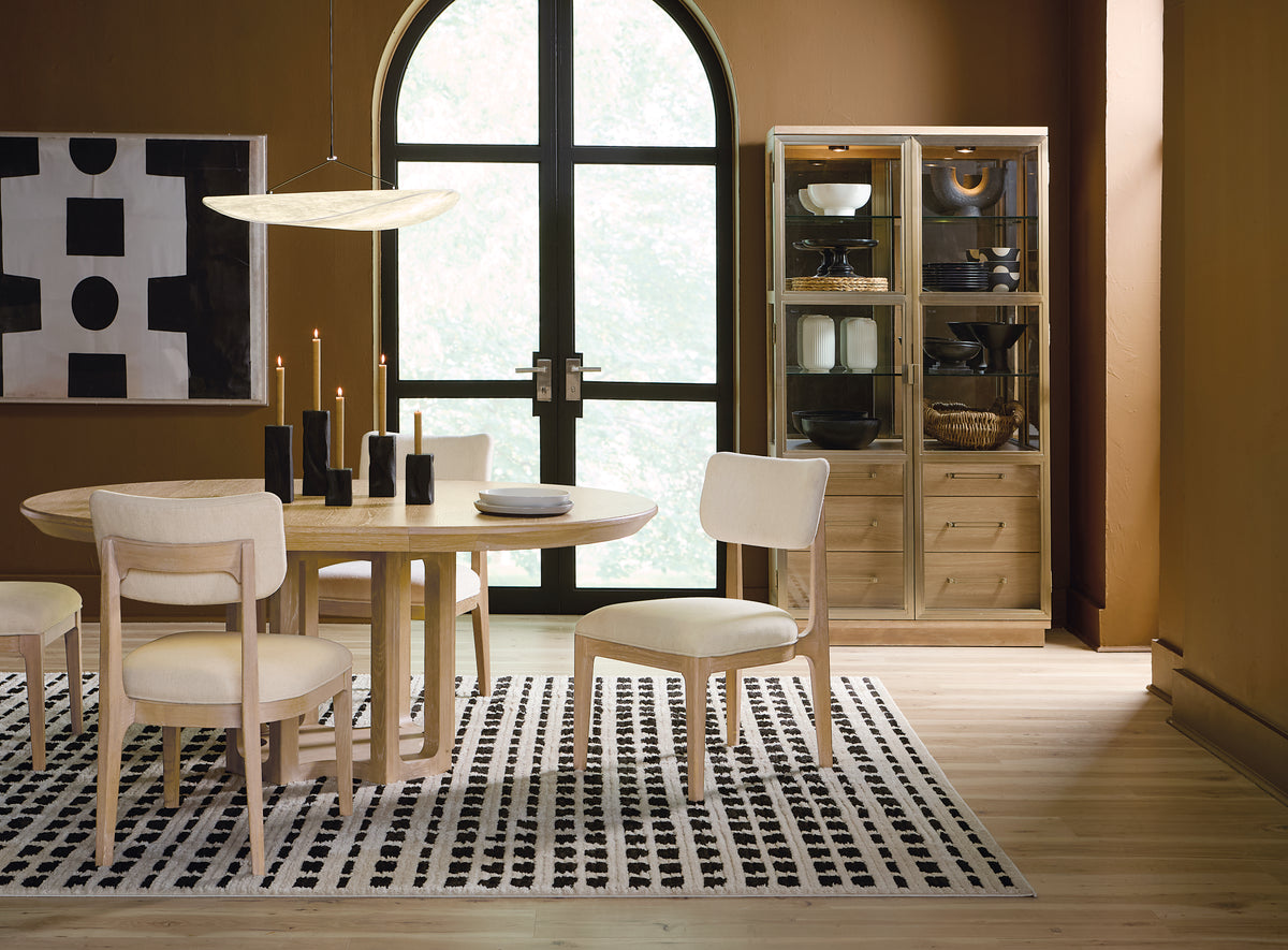 a dining room with a table and chairs