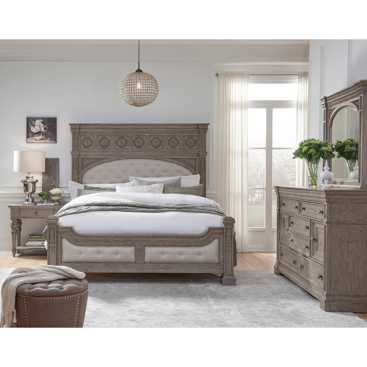 a bedroom with a bed and dresser