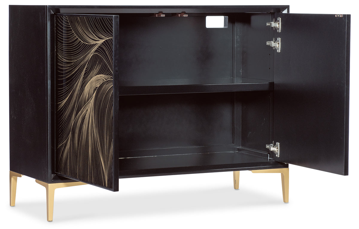 a black cabinet with gold designs