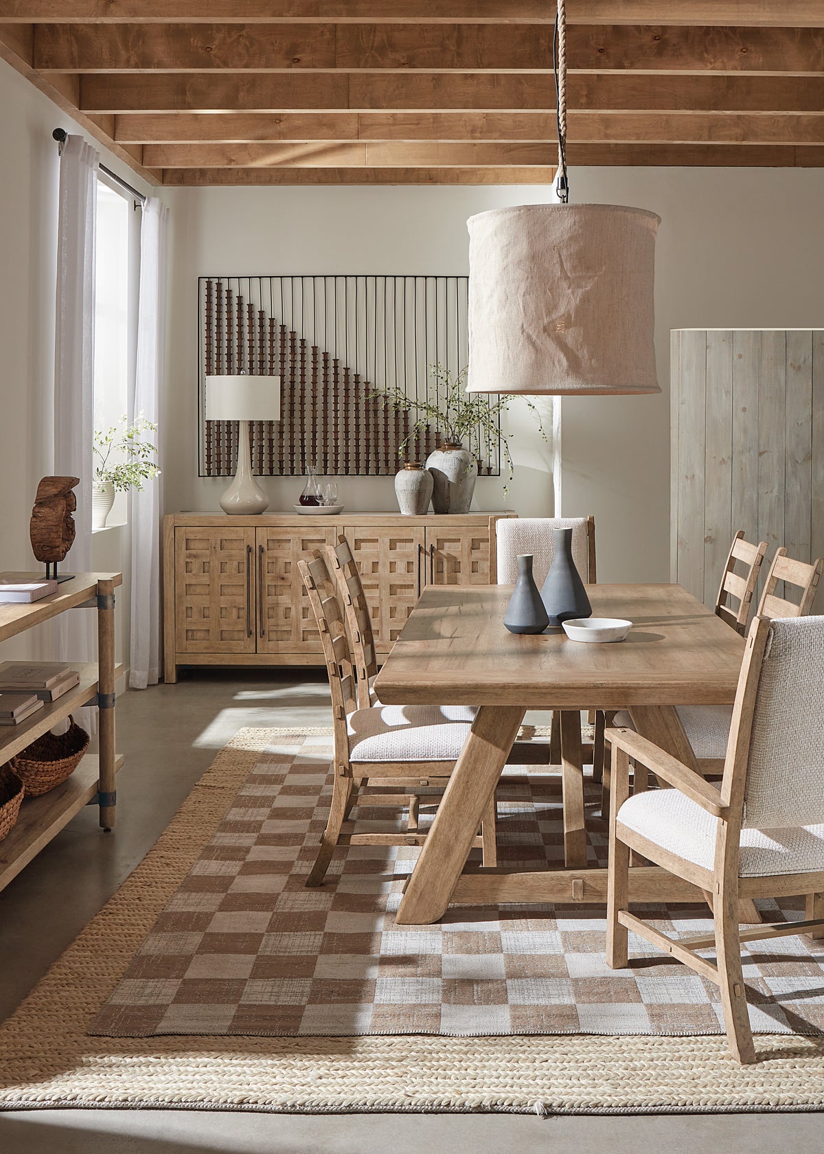 a dining room with a table and chairs