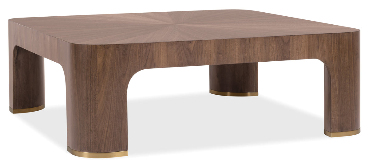 a brown wooden table with a gold base