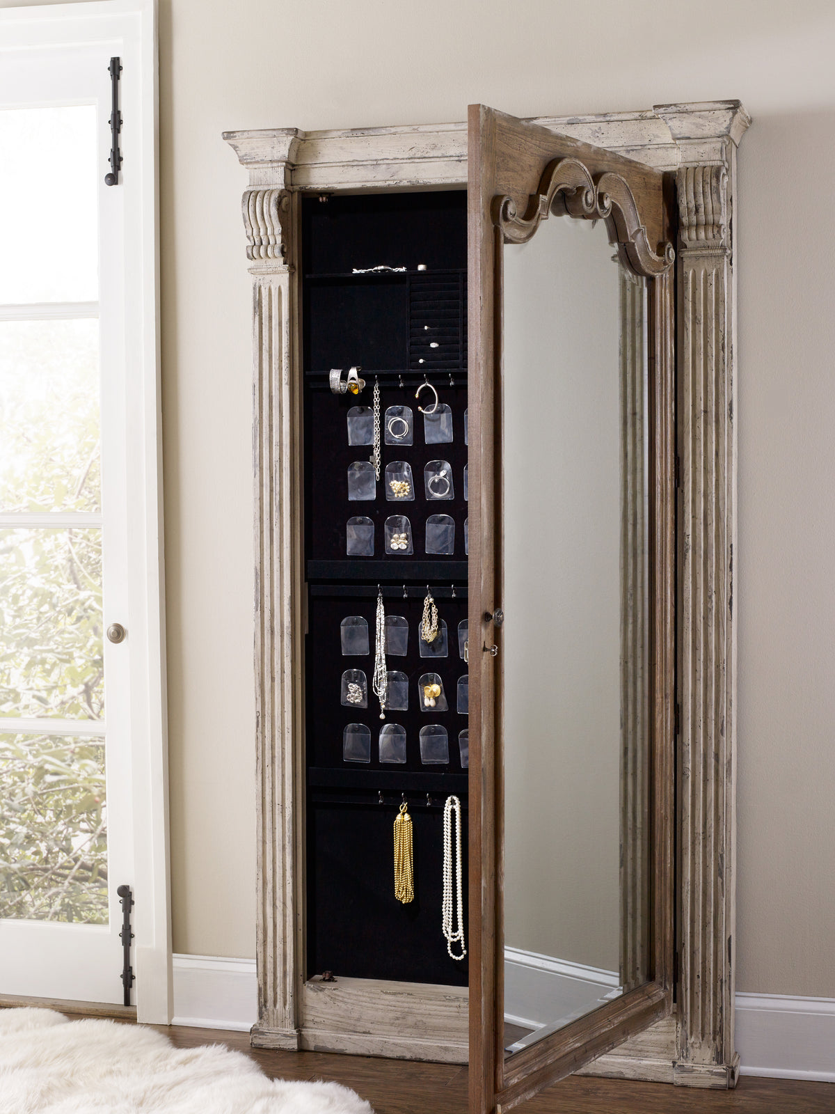 a mirror with a door and jewelry in it with 10 Downing Street in the background
