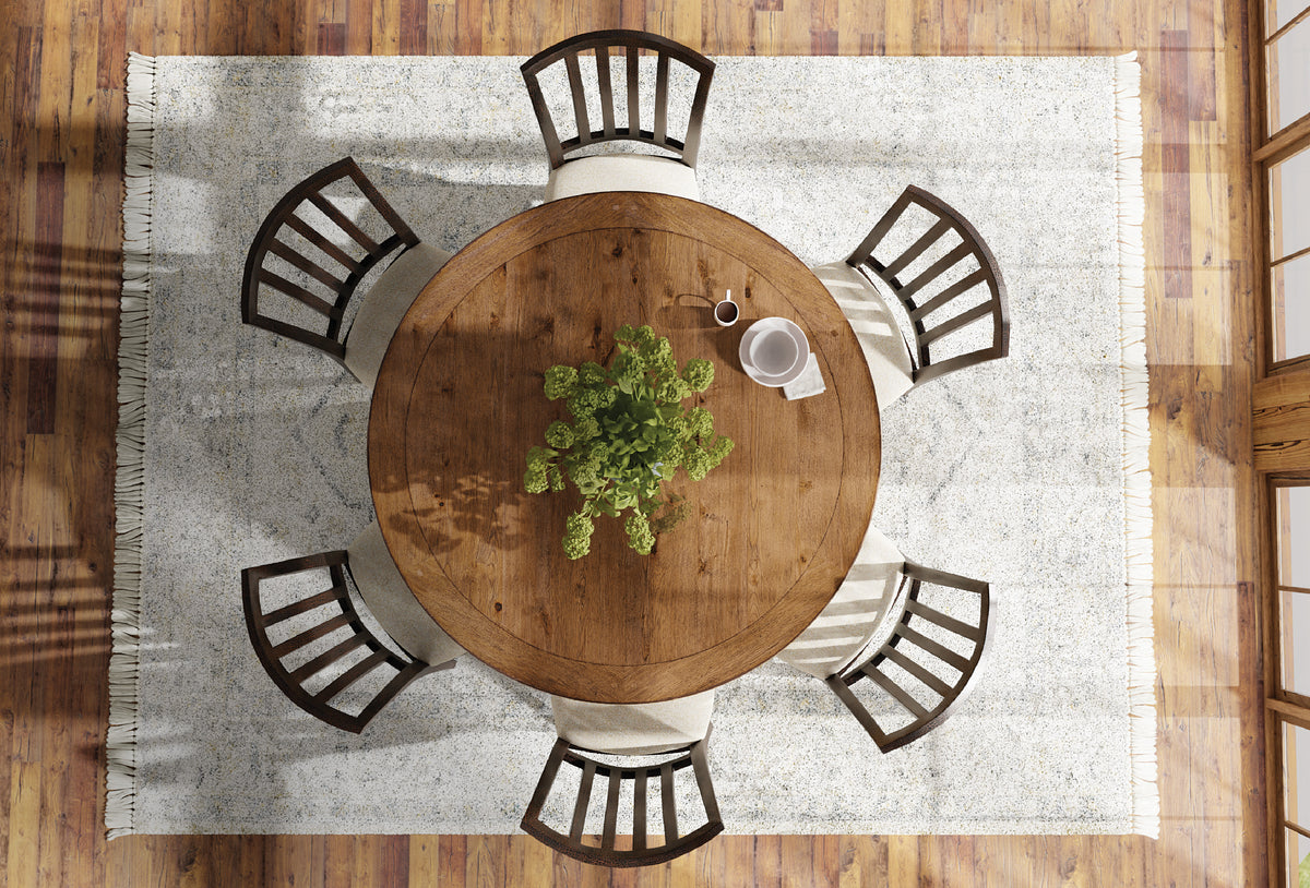 a table and chairs with a plant on it