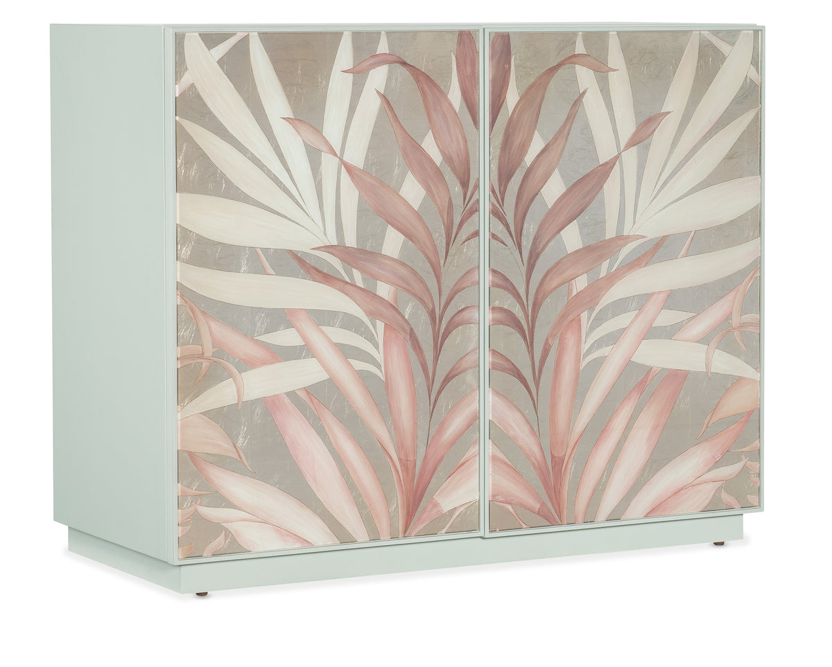 a white cabinet with pink and white leaves on it