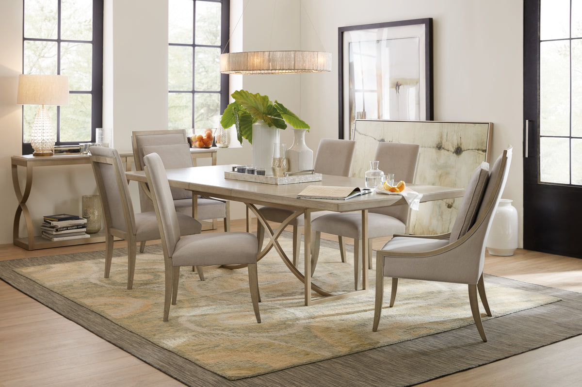 a dining room with a table and chairs