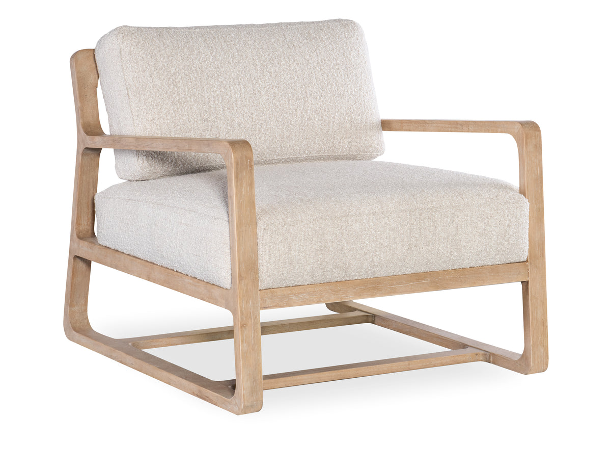 a white chair with wooden arms