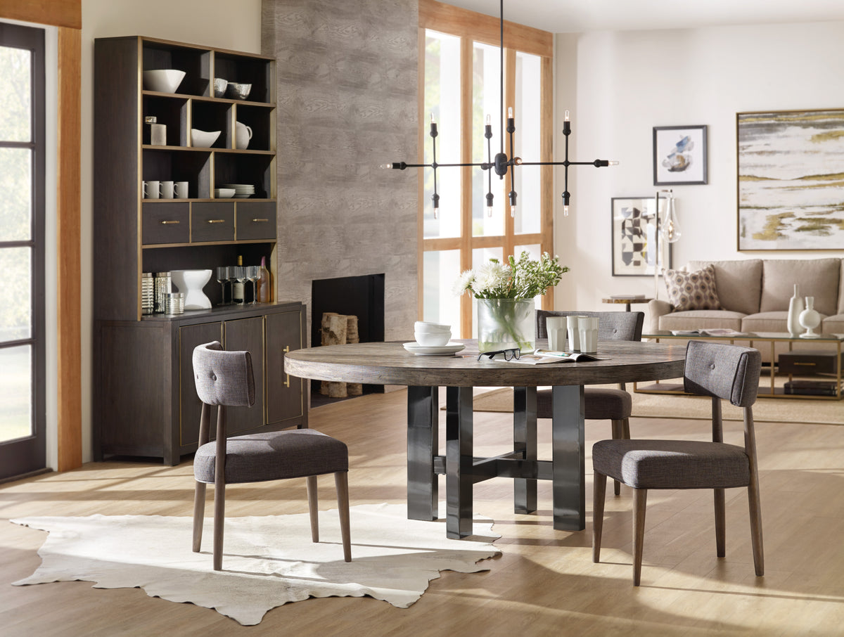 a dining room with a table and chairs