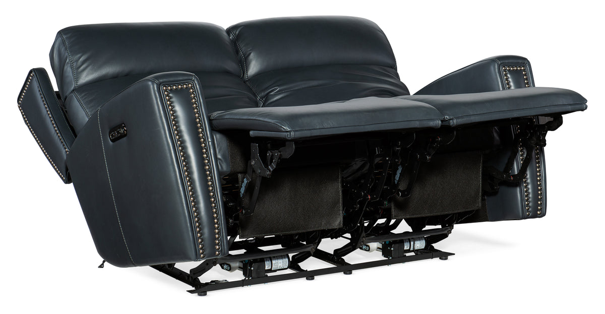 a black leather couch with two recliners