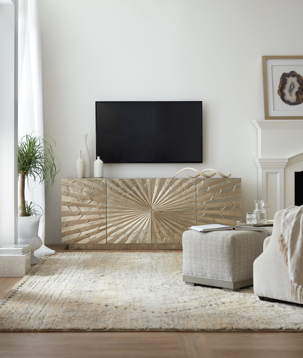 a living room with a tv on the wall