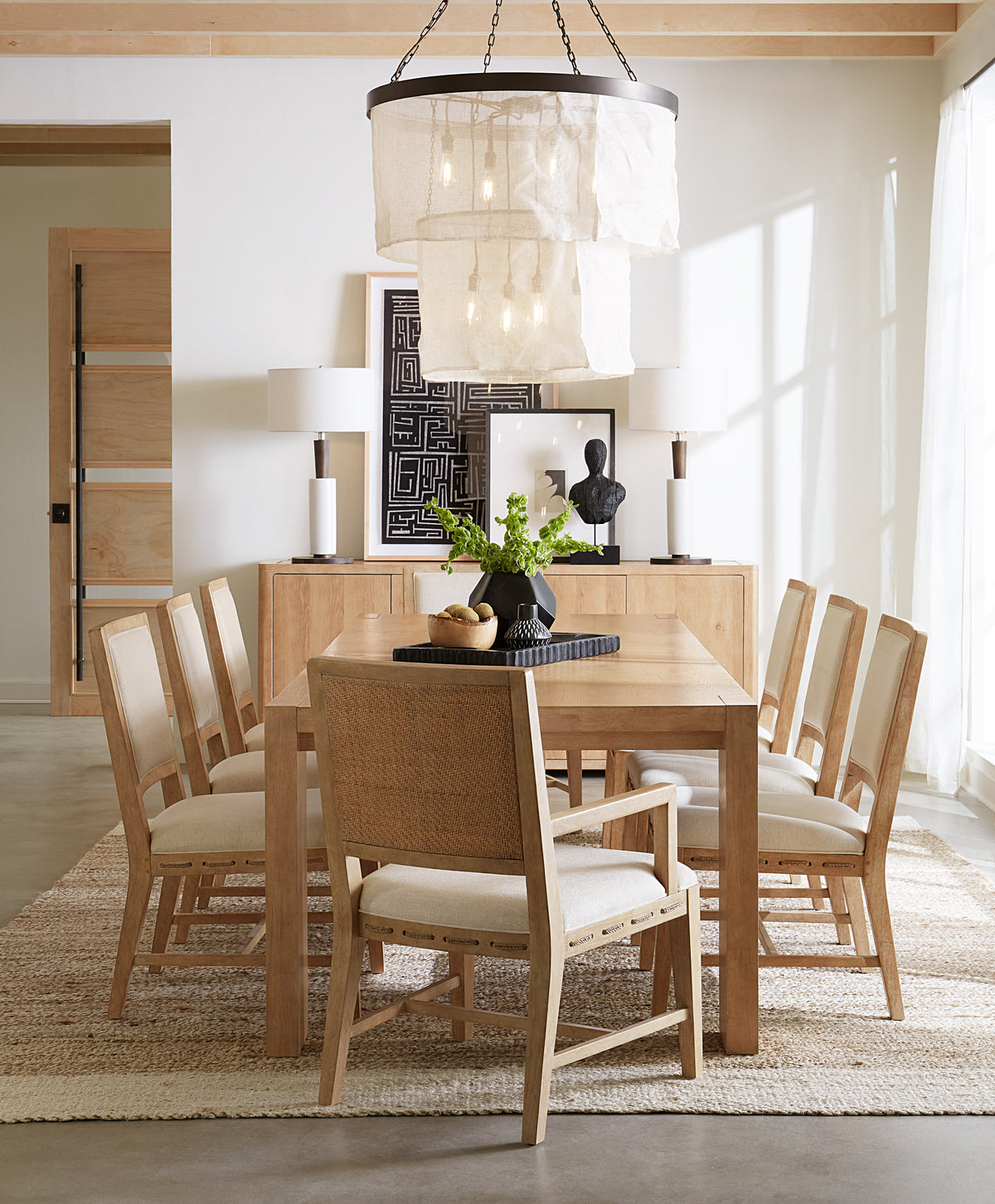 a dining table with chairs in a room