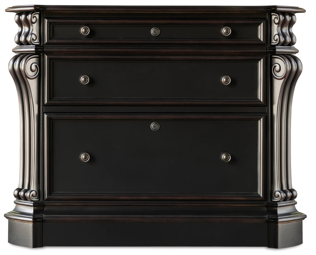 a black dresser with silver knobs