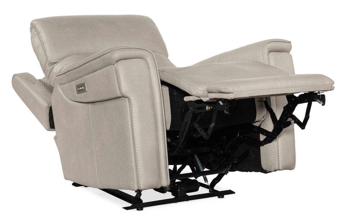 a white recliner with armrests
