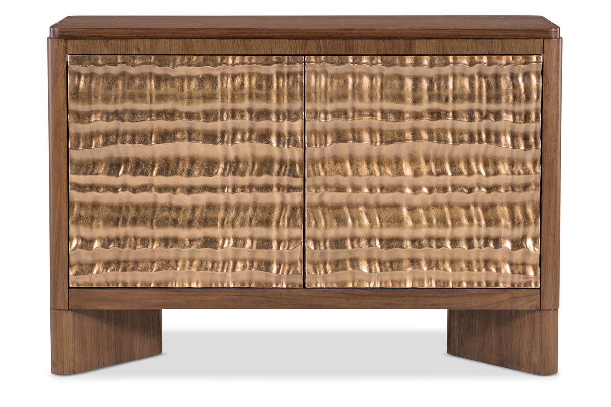 a brown cabinet with a gold textured surface