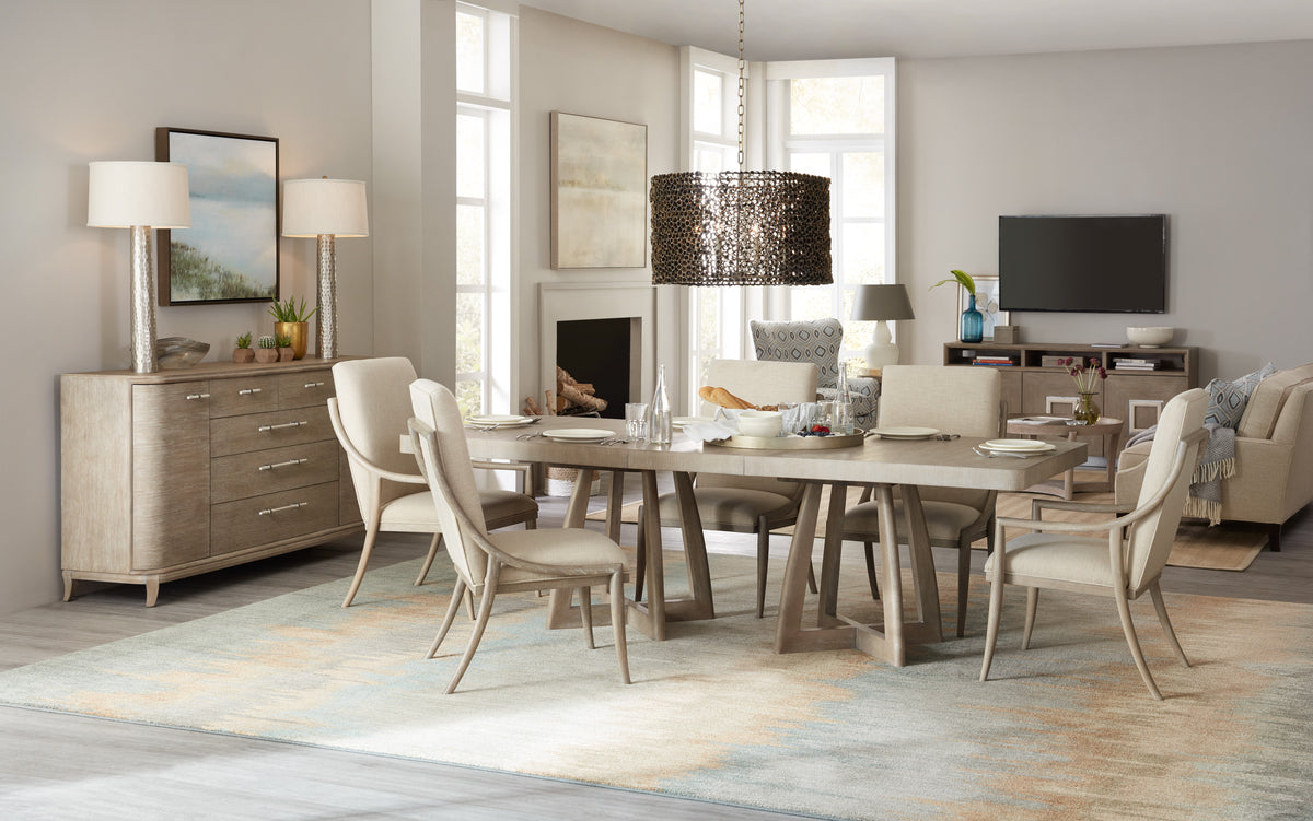 a dining room with a table and chairs