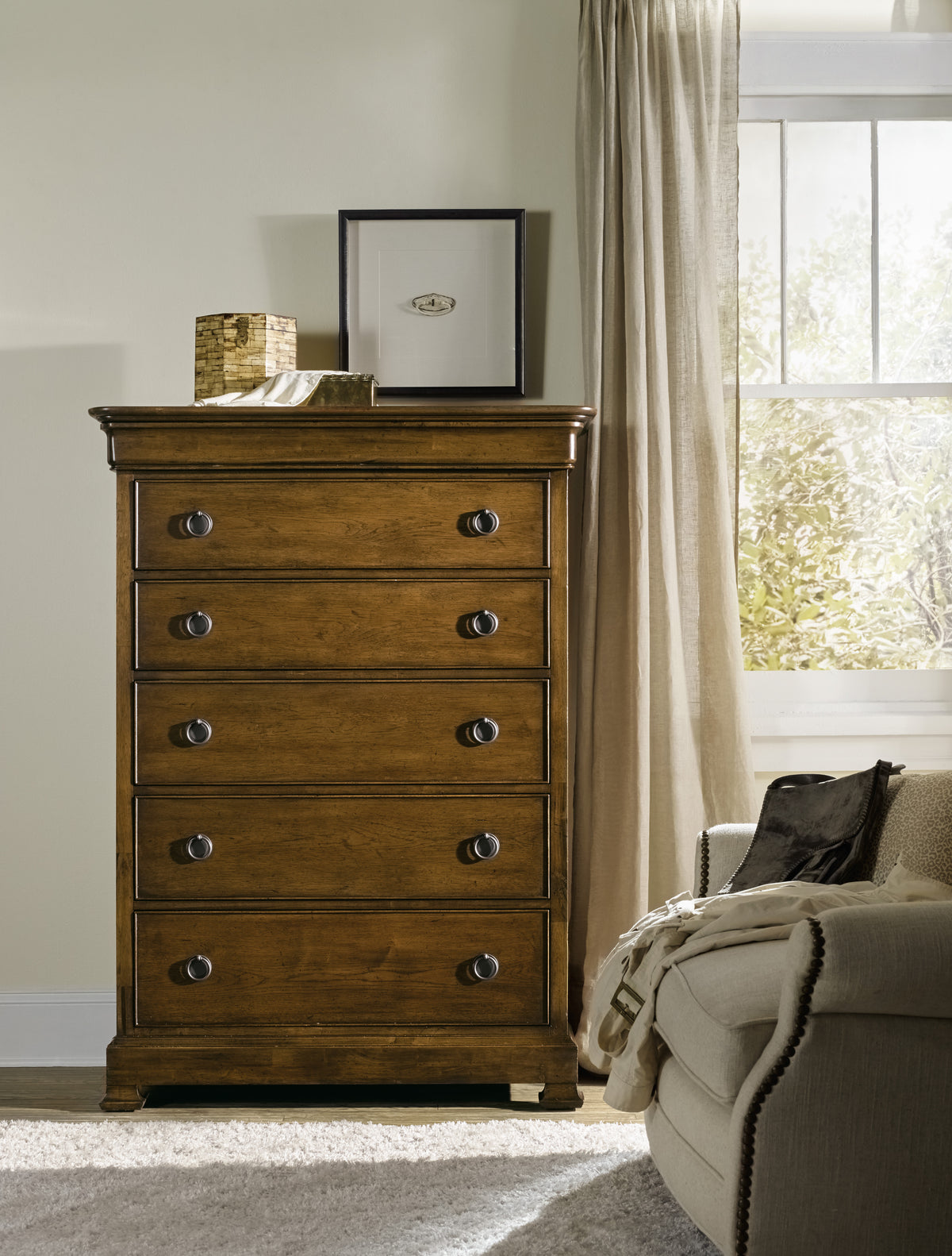 a dresser with a picture on top