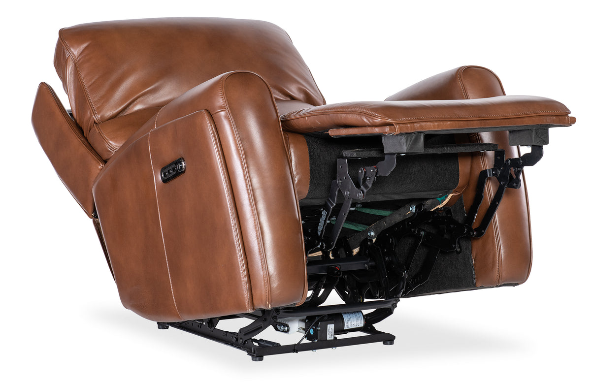 a brown leather recliner chair