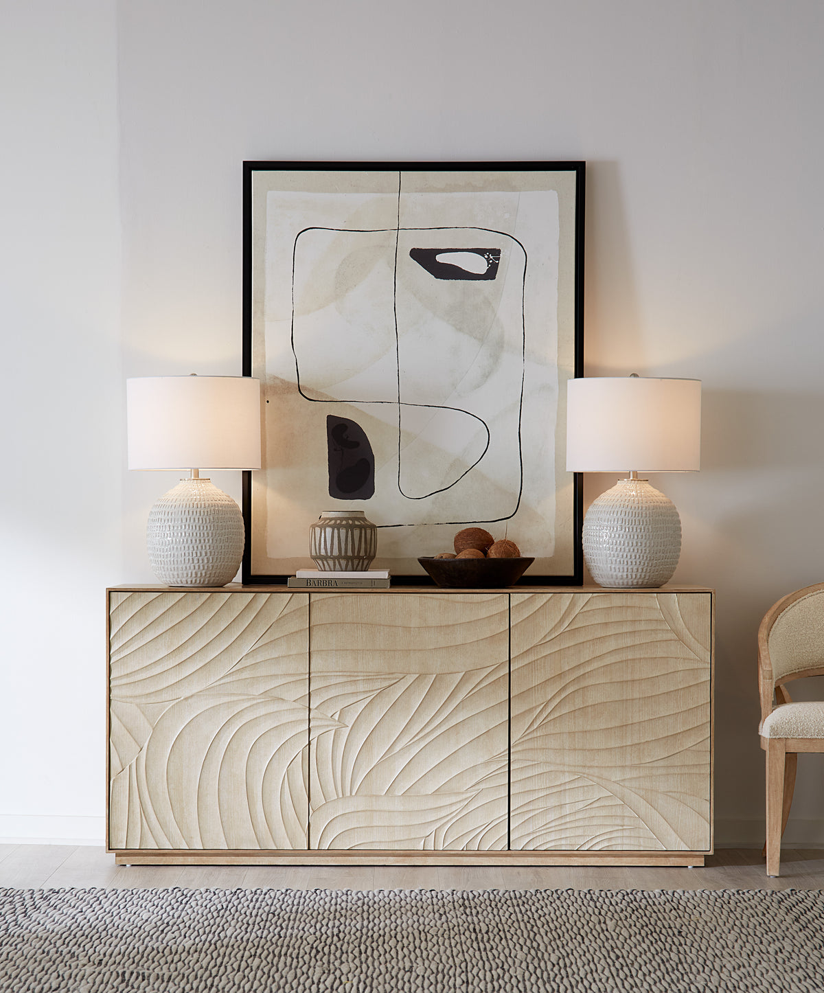 a white and black painting on a cabinet