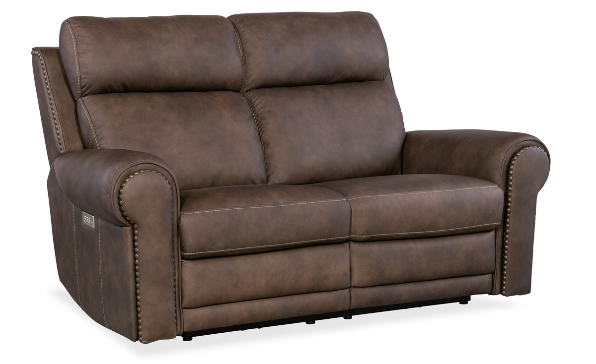 a brown leather couch with white stitching