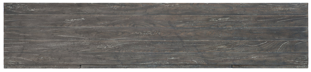a close up of a wood surface with Nazca Lines in the background