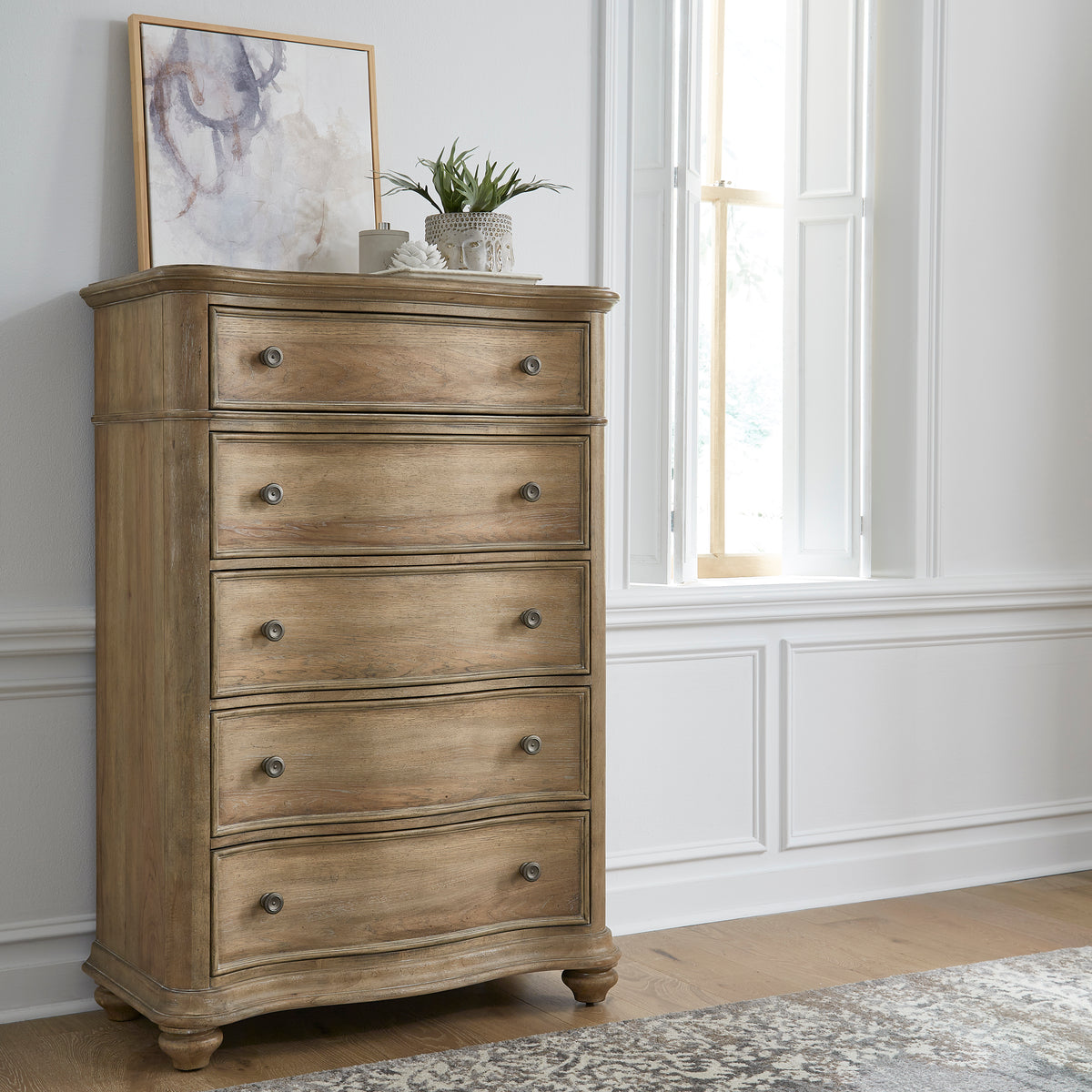 a dresser with a plant on top