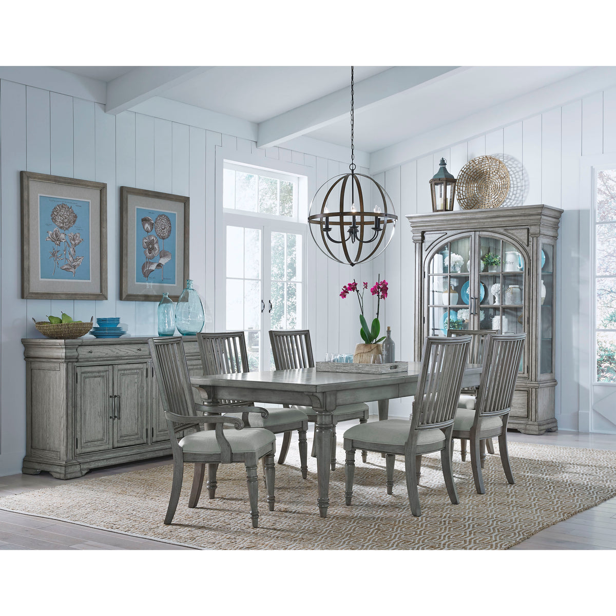 a dining room with a table and chairs