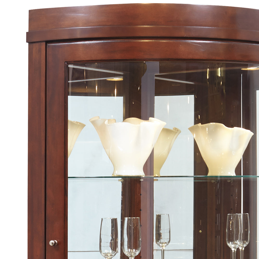 a glass cabinet with white vases on top