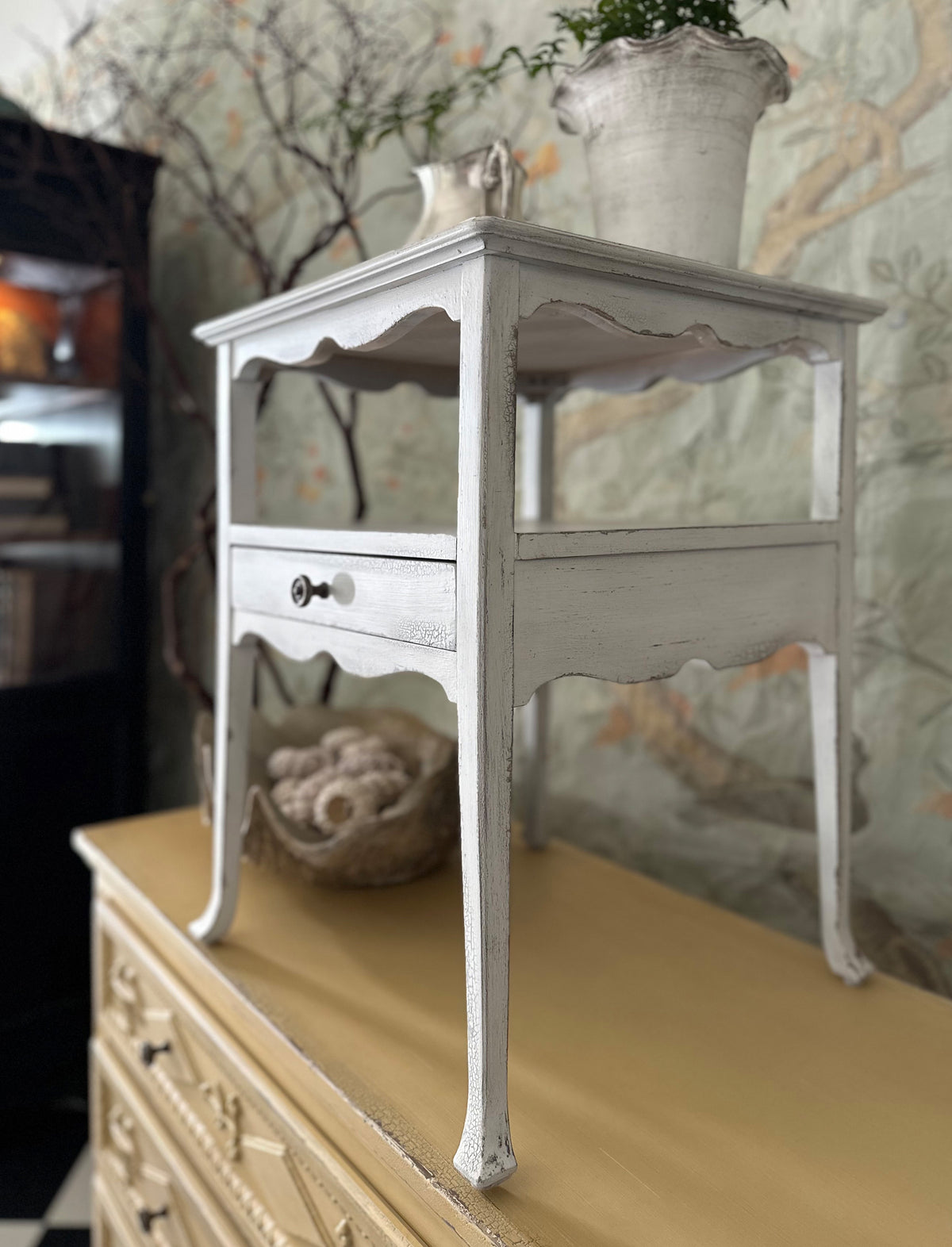 a white table on a dresser