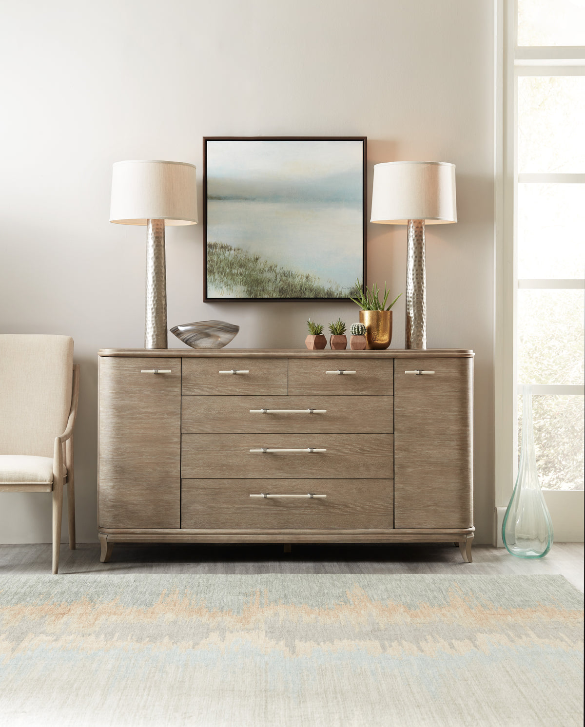 a dresser with a painting on it