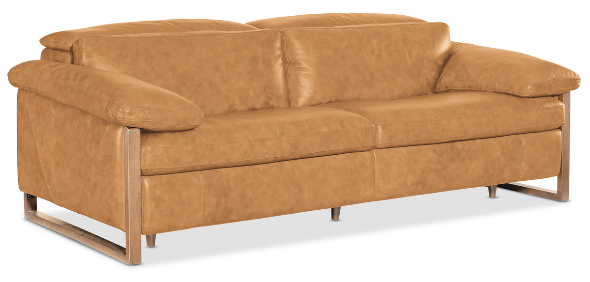 a brown leather couch with wooden legs