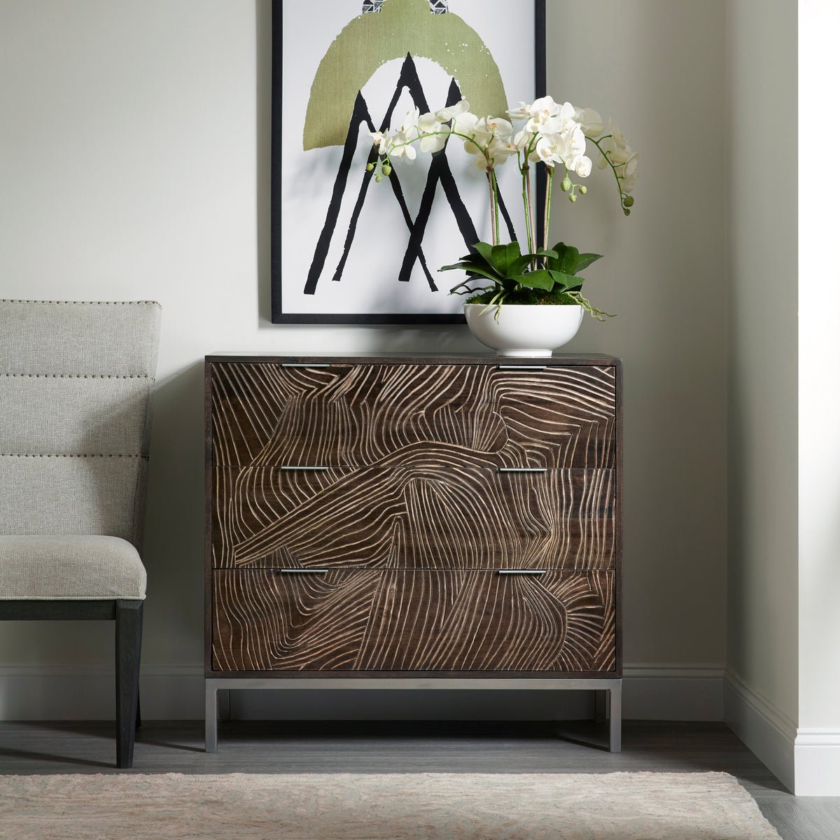 a dresser with a plant on top