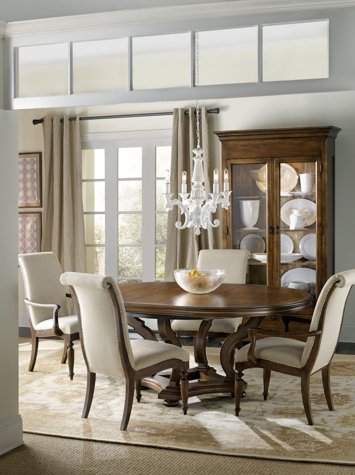 a dining room with a chandelier and a table