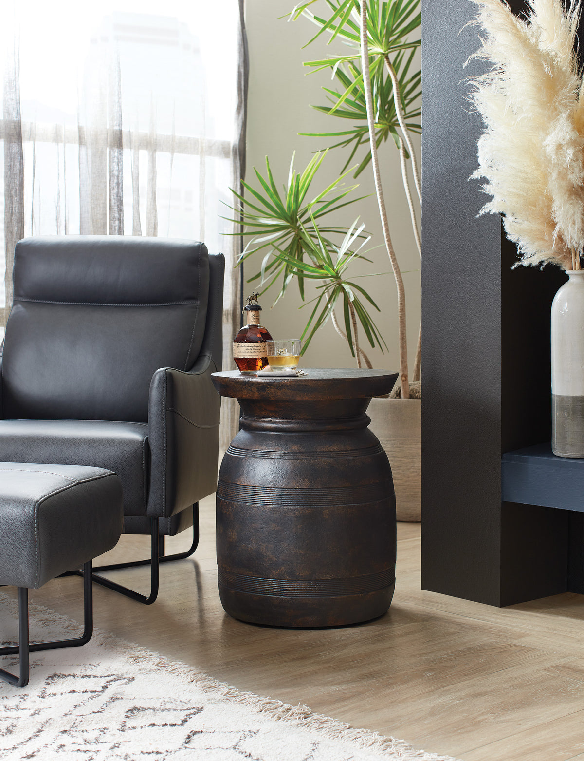 a chair and a vase with plants