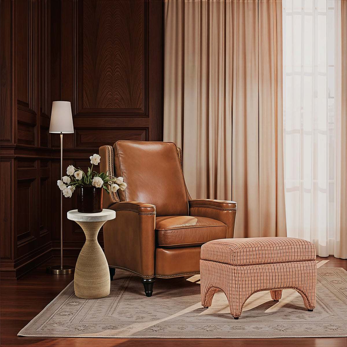 a chair and ottoman in a room