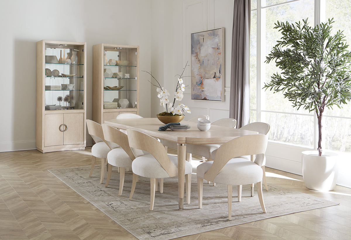 a dining room with a table and chairs