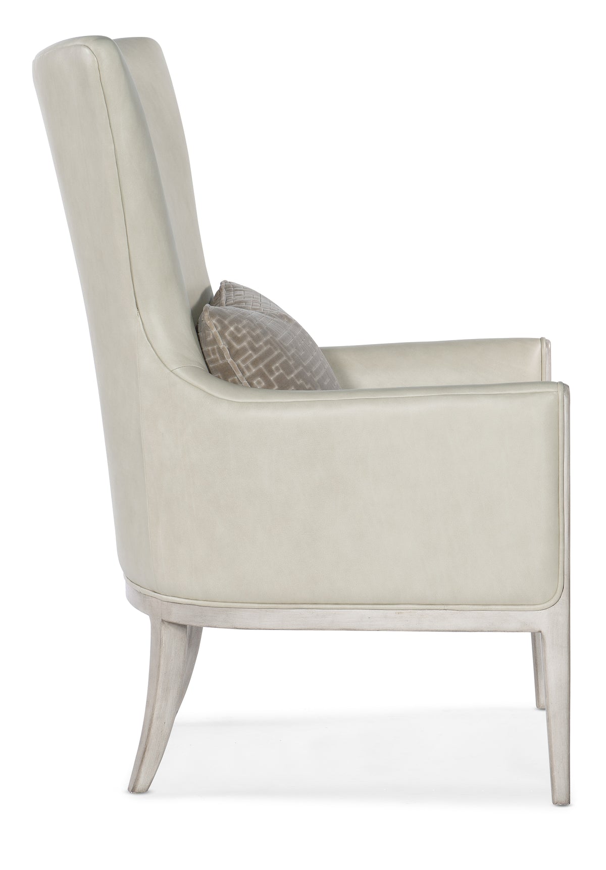a white chair with a pillow