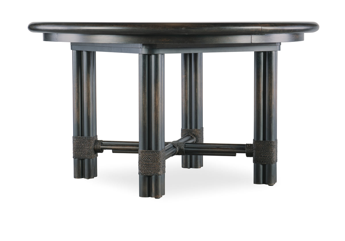 a round wooden table with four legs