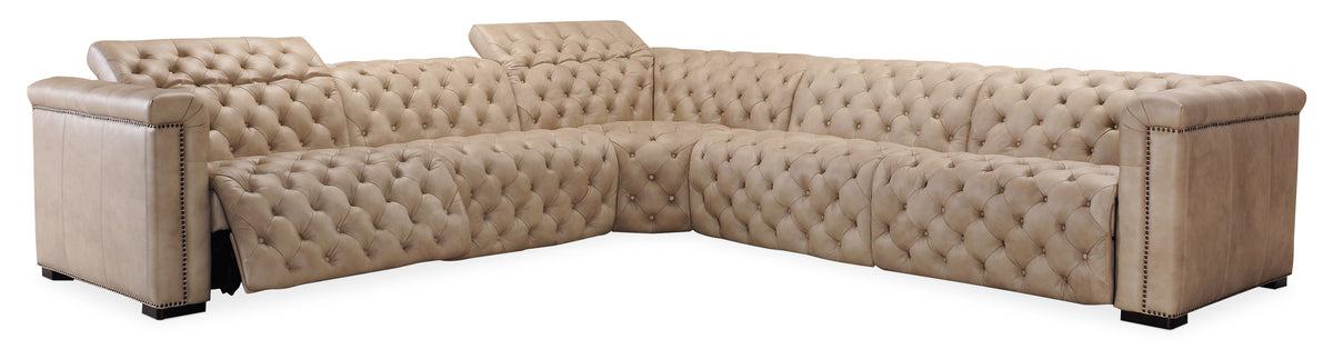 a tan leather couch with buttons