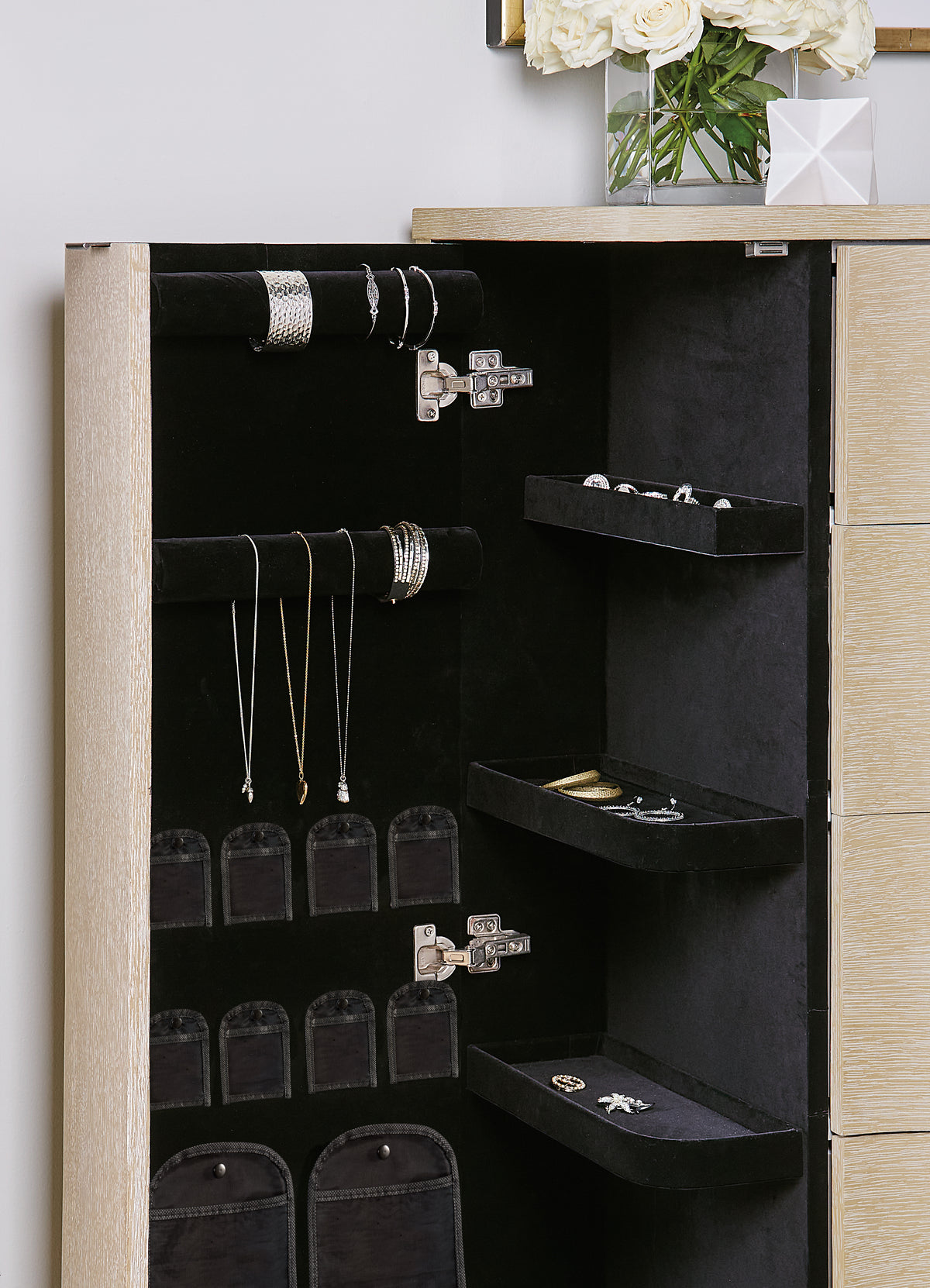 a jewelry box with a shelf and shelves